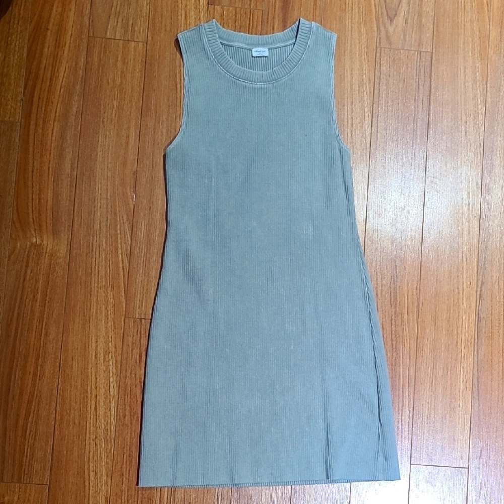 Sleeveless Dress in a light sage colour.